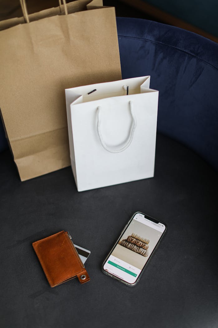 about-01 Modern online shopping setup with bags and smartphone.